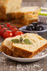 Savoury loaf cake with tomatoes, cheese and olives