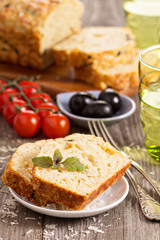 Savoury loaf cake with tomatoes, cheese and olives
