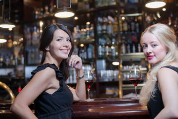 Two women drinking at an upmarket hotel