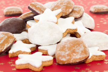 Mixed christmas cookies on red background