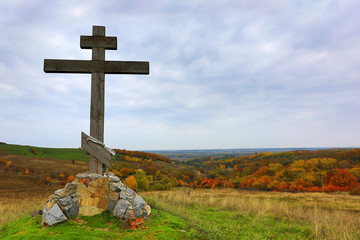 wooden cross on hill