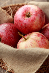 Red apples in a wooden basket