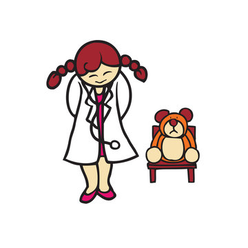 Little girl playing as a doctor with bear