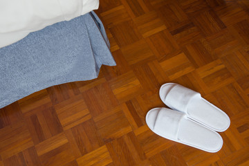 pair of white slippers on floor