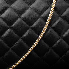 Black leather with golden chain