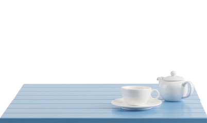 A porcelain cup and teapot on the wooden table with empty space