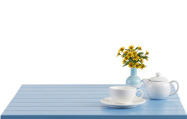 A porcelain cup and teapot on the wooden table with empty space
