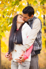 Fototapeta premium couple kissing outdoor in the park