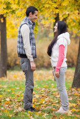 Teen couple at the park in autumn time