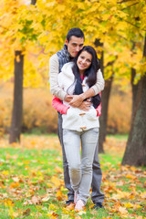 Teen couple at the park in autumn time