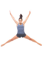 Fototapeta na wymiar Smiling sporty brunette jumping in the air