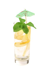Full glass of water with lemon and mint.