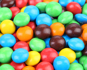 Fototapeta na wymiar Background of chocolate balls in colorful glaze.