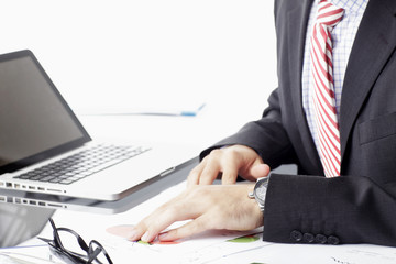 Businessman analyzing data in office