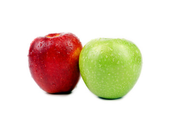 Green and red apples with water drops.