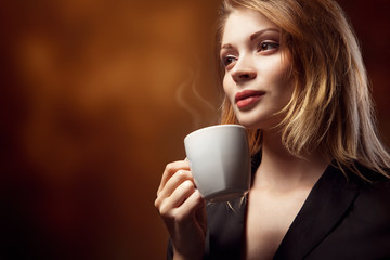 Beautiful Girl Drinking Tea or Coffee