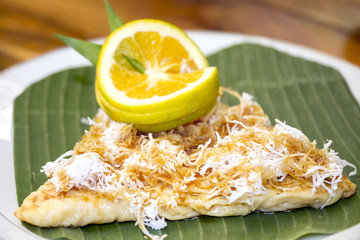 sweet pancakes with apricot jam on a white plate