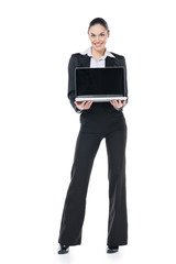 Smiling businesswoman holding computer in her hand