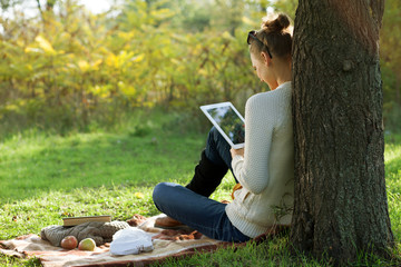 Distance education. Sitting woman using ipad