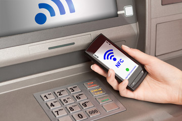 withdrawing money atm with mobile phone a NFC terminal