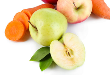 Sweet apples and carrots isolated on white