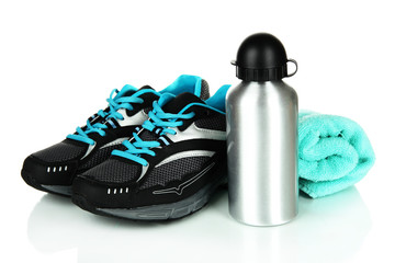 Sports bottle,sneakers and towel isolated on white