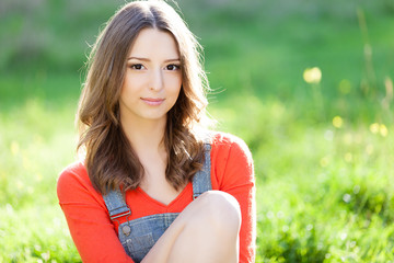 portrait of beautiful young woman in sun rays