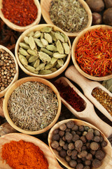 Fototapeta na wymiar Many different spices and fragrant herbs close-up background