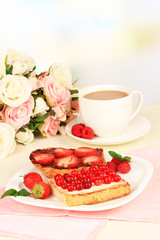 Delicious toast with berries on table close-up