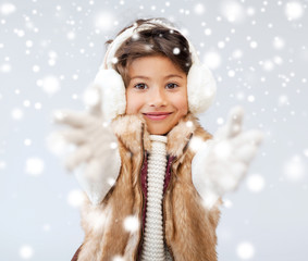 happy littl girl in winter clothes