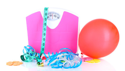 Scales and holiday attributes isolated on white