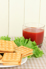 Sandwich crackers with cheese and tomato juice