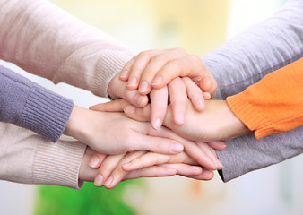 Human hands on bright background
