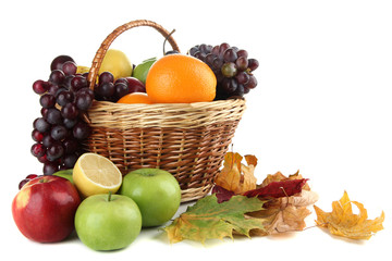 Naklejka na ściany i meble Different fruits with basket and yellow leaves isolated on