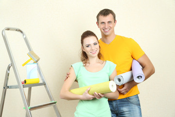 Young couple doing renovation in new house