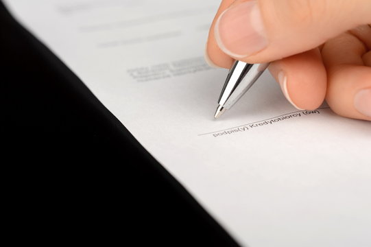 Hand signing a bank account contract