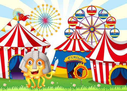 A monster at the carnival wearing a safety helmet and holding a