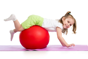 Kid having fun with  gymnastic ball isolated