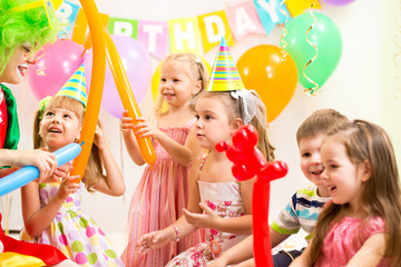 kids group and clown on birthday party