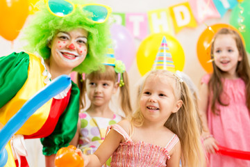 kids group and clown on birthday party
