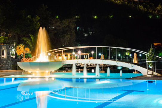 Water Pool And Fountain At Night