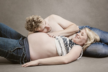 Naklejka premium Loving happy couple, pregnant woman with her husband