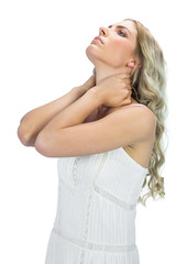 Fototapeta premium Thoughtful sensual blonde holding her neck