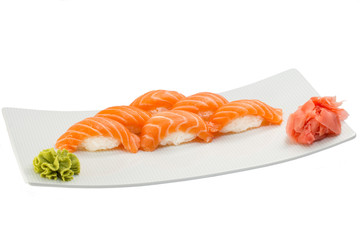 Isolated salmon sushi nigiri with ginger and wasabi