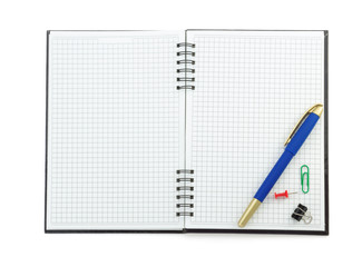 school supplies on checked notebook