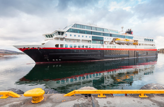 Big modern passenger cruise ship enters the port