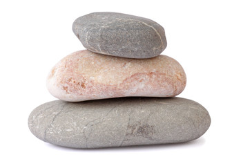 Fototapeta na wymiar pile of three stones over white