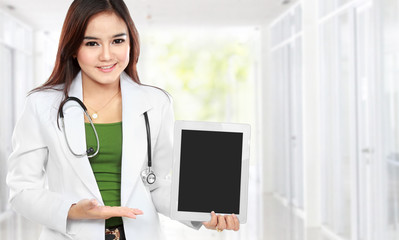 Copy-spaced portrait of female doctor wearing a white coat and s