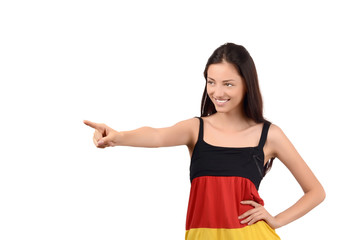Girl pointing to the side.Young woman with Germany flag blouse
