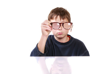 boy with glasses and low vision